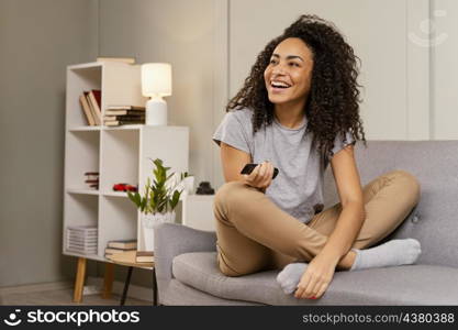 woman couch watching tv