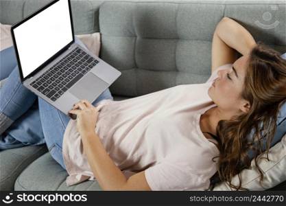 woman couch with laptop