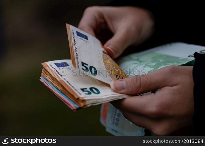 Woman counting money, counting EURO close up