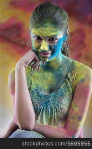 Woman covered in holi colours