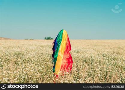 woman covered with lgbt flag