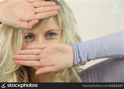 Woman covering face with hands