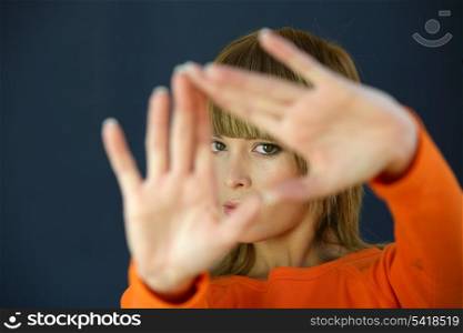 Woman covering her face with her hands