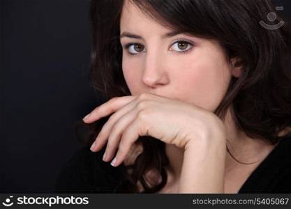 Woman covering her mouth with her hand
