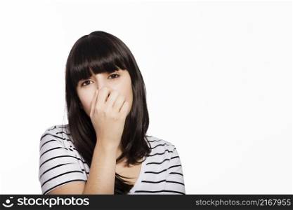 woman covering nose