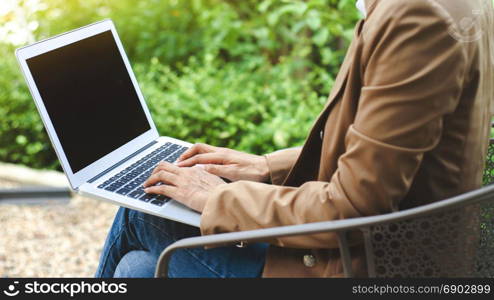 woman creative business using laptop at a outdoor with nature