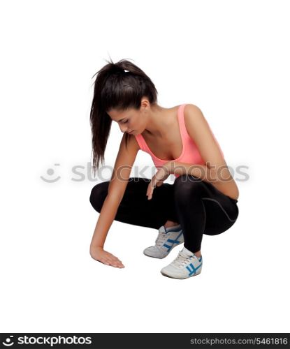Woman crouching in their training isolated on white background