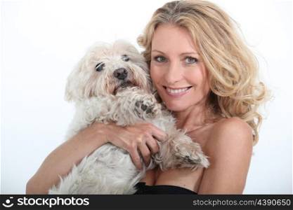 Woman cuddling dog