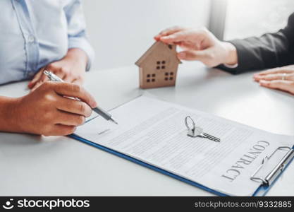 Woman customer sign agreement buying home ,salesman receive money after good deal after successful loan contract