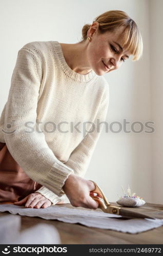 woman cutting fabric