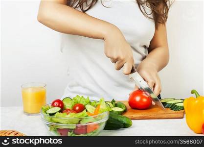 woman cutting tomato