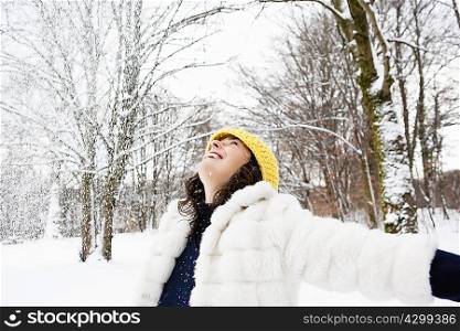 Woman dancing in snowy woods
