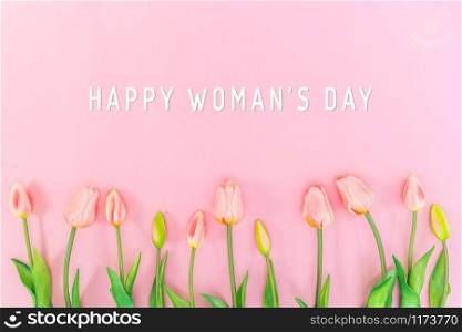 Woman Day composition. Tulip flowers on pink background Flat lay top view copy space