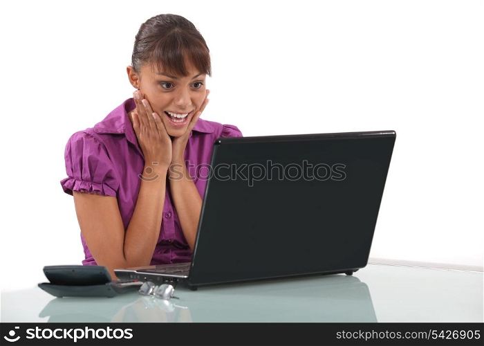 Woman delighted with her laptop