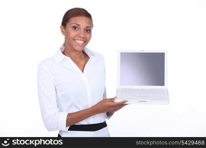 Woman demonstrating a laptop
