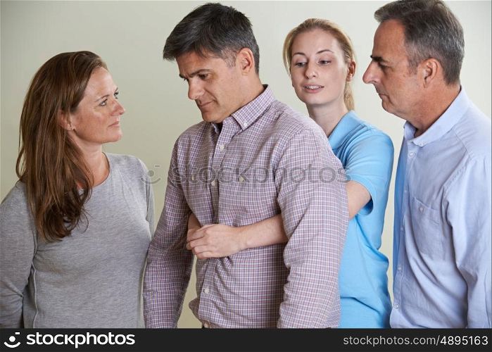 Woman Demonstrating Heimlich Maneuver In First Aid Class