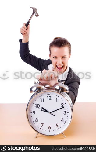 Woman desperate with time hitting clock with hammer