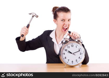 Woman desperate with time hitting clock with hammer