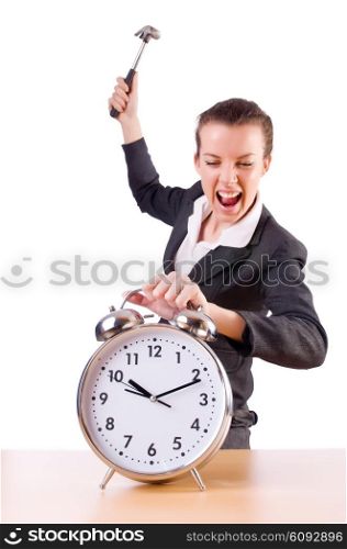 Woman desperate with time hitting clock with hammer