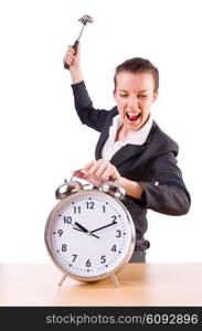 Woman desperate with time hitting clock with hammer