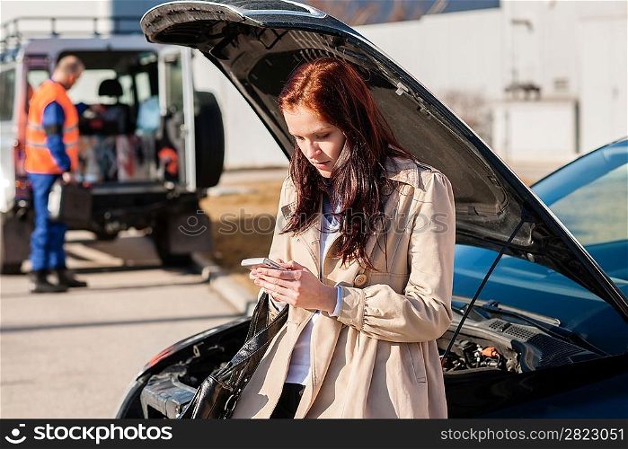 Woman dialing her phone after car breakdown problem mechanic crash