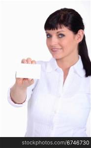 Woman displaying a business card