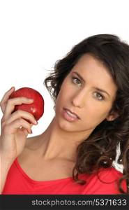 Woman displaying red apple