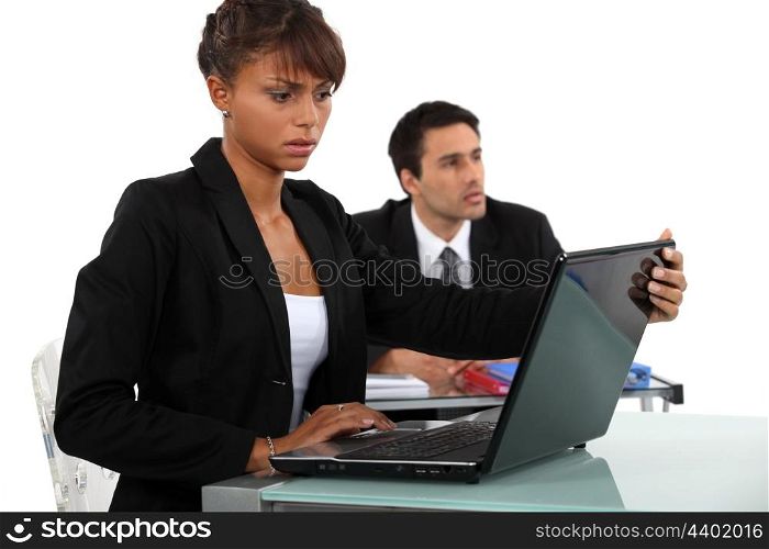 Woman disturbed by her laptop