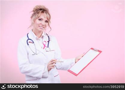 Woman doctor diagnose patient. Diagnosis of breast cancer. Blonde middle aged female holding red folder with files of desease diagnose. Specialist inform patient about results.