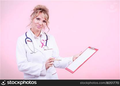 Woman doctor diagnose patient. Diagnosis of breast cancer. Blonde middle aged female holding red folder with files of desease diagnose. Specialist inform patient about results.