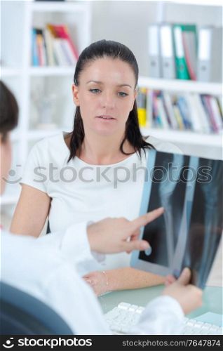 woman doctor holding an x ray in the hospital