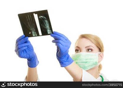 Woman doctor in lab coat with looking at the arm x-ray image isolated. Medical person for health insurance.