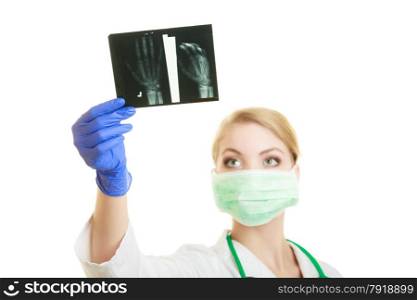 Woman doctor in lab coat with looking at the arm x-ray image isolated. Medical person for health insurance.