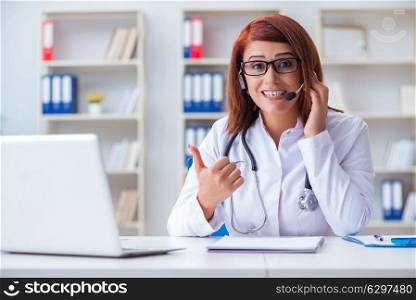 Woman doctor in telemedicine concept. The woman doctor in telemedicine concept