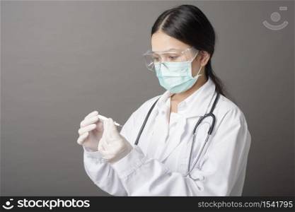 woman doctor is using Fever Thermometer
