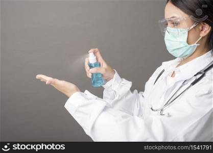 woman doctor is using hand sanitizer
