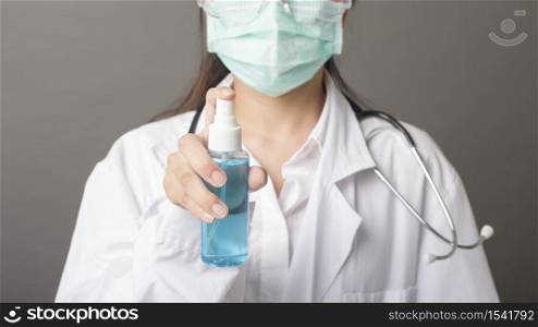 woman doctor is using hand sanitizer