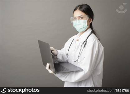 Woman Doctor is using laptop
