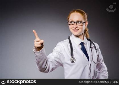 Woman doctor pressing virtual button