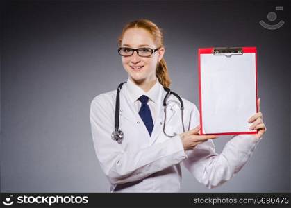 Woman doctor with paper notepad