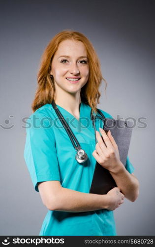 Woman doctor with paper notepad