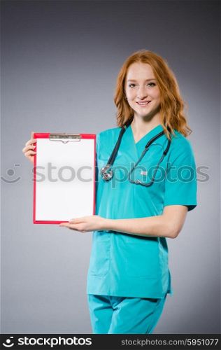 Woman doctor with paper notepad