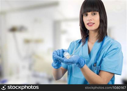woman doctor with pills in hand closeup
