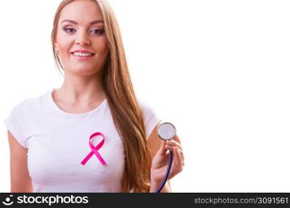 Woman doctor with stethoscope and pink ribbon aids symbol on chest. Health care, medicine breast cancer awareness concept.. Woman with pink ribbon aids symbol and stethoscope on chest.