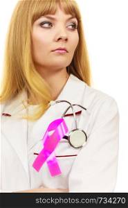 Woman doctor with stethoscope and pink ribbon aids symbol on chest. Healthcare, medicine breast cancer awareness concept. . Woman doctor with pink ribbon aids symbol