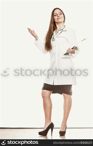 Woman doctor with stethoscope, clipboard and pen wearing white coat. Health care.. Woman doctor with stethoscope, clipboard and pen.
