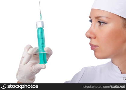 Woman doctor with syringe on white