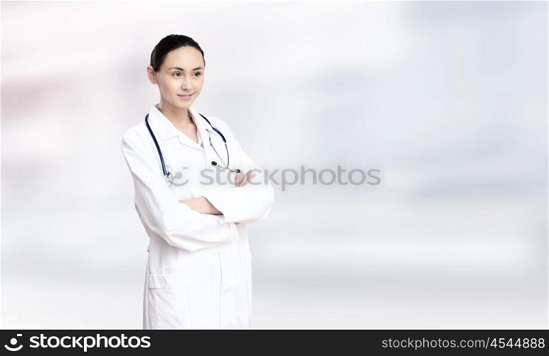 Woman doctor. Young attractive woman doctor with stethoscope on neck