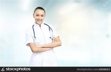 Woman doctor. Young attractive woman doctor with stethoscope on neck