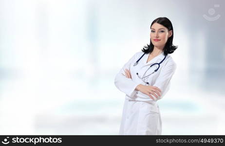 Woman doctor. Young attractive woman doctor with stethoscope on neck